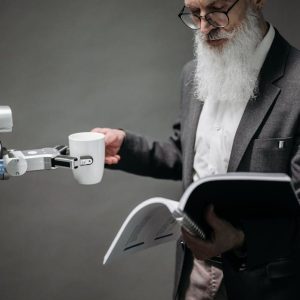 Reading Man Taking Coffee from a Robot